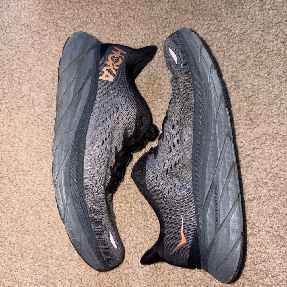 HOKA Clifton 9 Black and Charcoal Running Shoes with Copper Accent